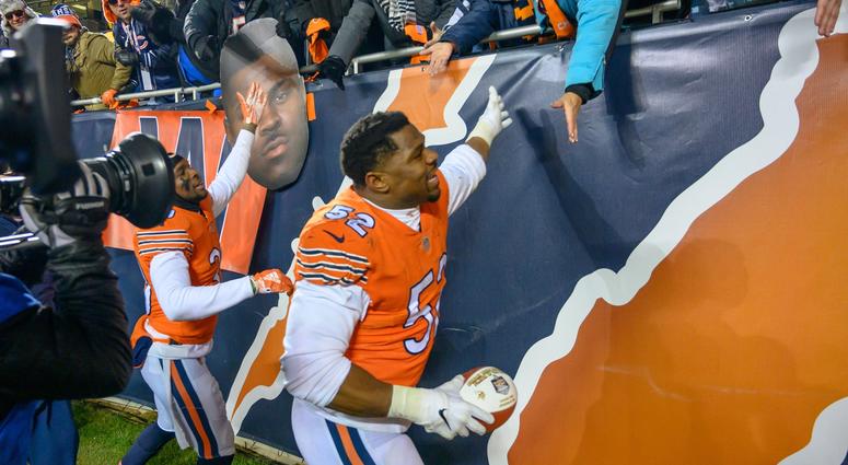 Bears linebacker Khalil Mack (52) celebrates with fans after a win against the Vikings. Bears linebacker Khalil Mack (52) celebrates with fans after a win against the Vikings.