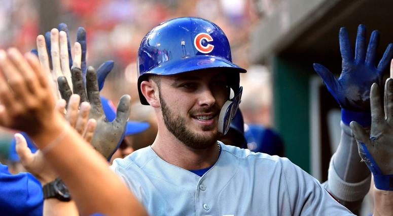 Cubs third baseman Kris Bryant is congratulated by teammates after homering. Cubs third baseman Kris Bryant is congratulated by teammates after homering.
