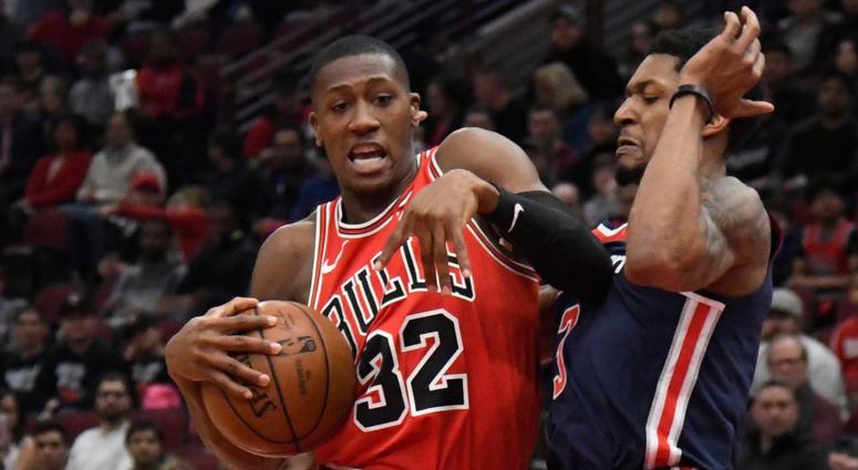 Bulls guard Kris Dunn (32) is defended by Wizards guard Bradley Beal (3). Bulls guard Kris Dunn (32) is defended by Wizards guard Bradley Beal (3).