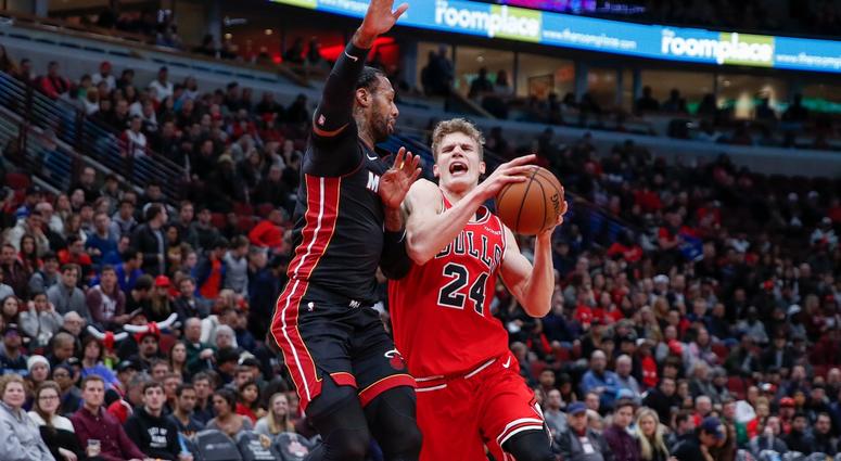 Bulls forward Lauri Markkanen (24) is fouled by Heat forward James Johnson (16). Bulls forward Lauri Markkanen (24) is fouled by Heat forward James Johnson (16).