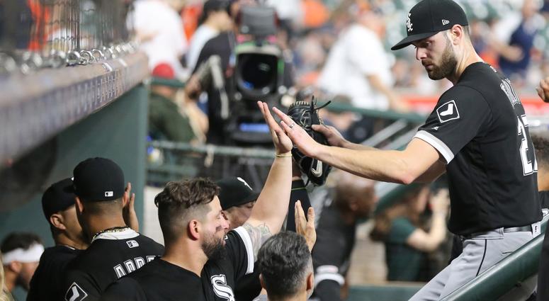 White Sox right-hander Lucas Giolito, right, receives congratulations from teammates. White Sox right-hander Lucas Giolito, right, receives congratulations from teammates.