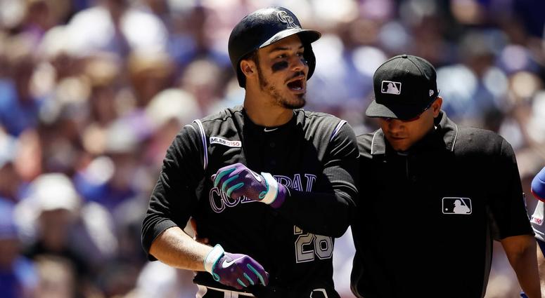 Rockies third baseman Nolan Arenado (28) reacts after being hit by a pitch by the Cubs. Rockies third baseman Nolan Arenado (28) reacts after being hit by a pitch by the Cubs.