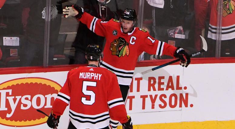 Blackhawks center Jonathan Toews (19) celebrates with defenseman Connor Murphy (5) after scoring the game-winning goal against the Canucks in overtime. Blackhawks center Jonathan Toews (19) celebrates with defenseman Connor Murphy (5) after scoring the game-winning goal against the Canucks in overtime.