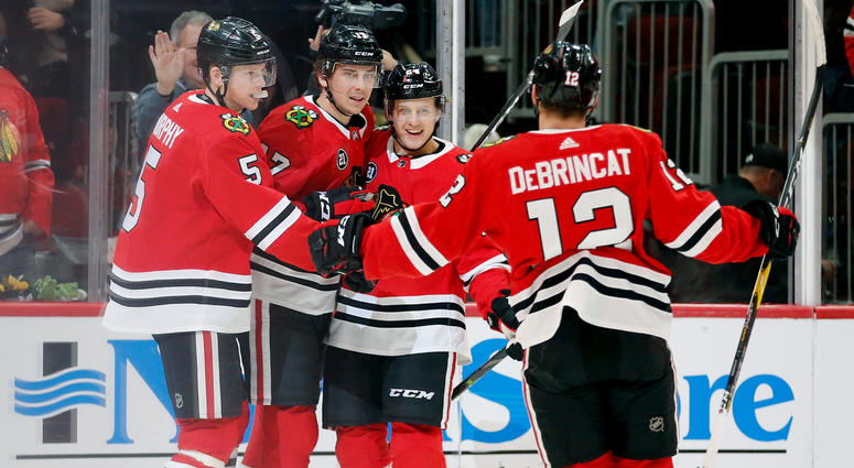 The Blackhawks celebrate a goal by Dylan Strome (17). The Blackhawks celebrate a goal by Dylan Strome (17).