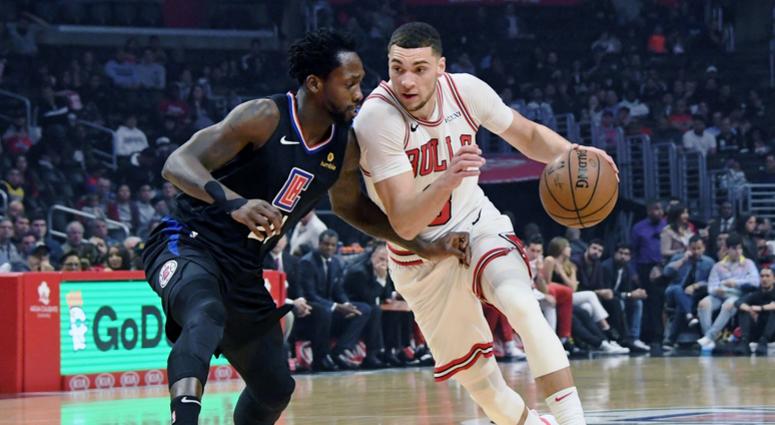 Bulls guard Zach LaVine (8) is defended by Clippers guard Patrick Beverley (21). Bulls guard Zach LaVine (8) is defended by Clippers guard Patrick Beverley (21).