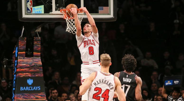 Bulls guard Zach LaVine (8) dunks the ball against the Nets. Bulls guard Zach LaVine (8) dunks the ball against the Nets.
