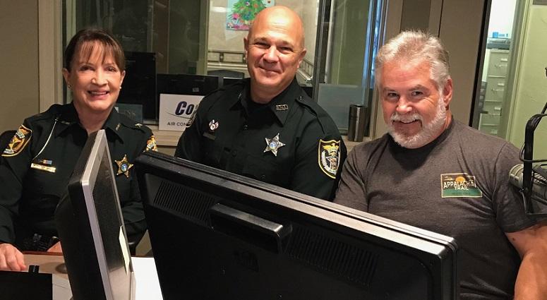 Alachua County Sheriff Sadie Darnell and Deputy Cary Gallop with Bob Rose