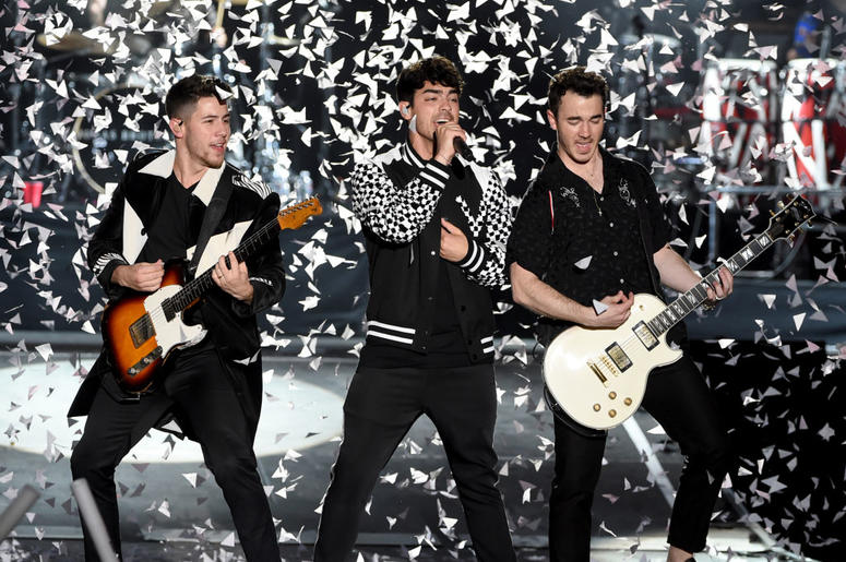 Nick Jonas, Joe Jonas and Kevin Jonas Nick Jonas, Joe Jonas and Kevin Jonas of the Jonas Brothers perform onstage