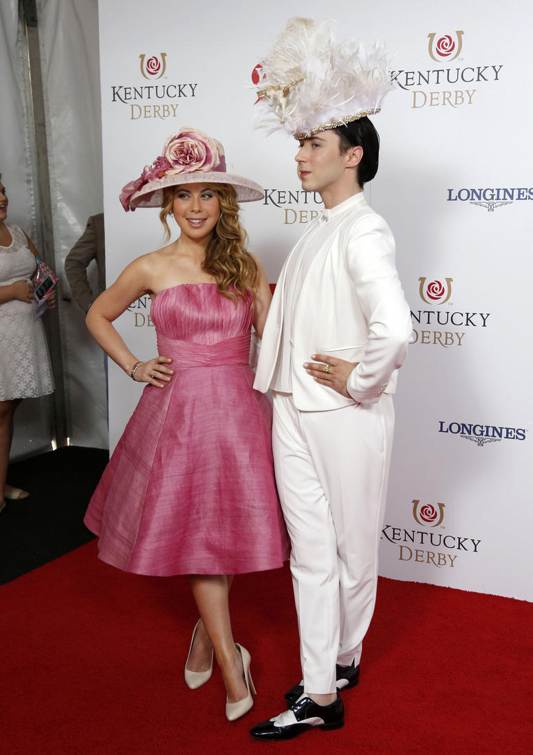Former figure skating stars Tara Lipinski and Johnny Weir appear on the red carpet before the 140th running of the Kentucky Derby at Churchill Downs in Louisville, Ky., on May 3, 2014. Tara Lipinski & Johnny Weir