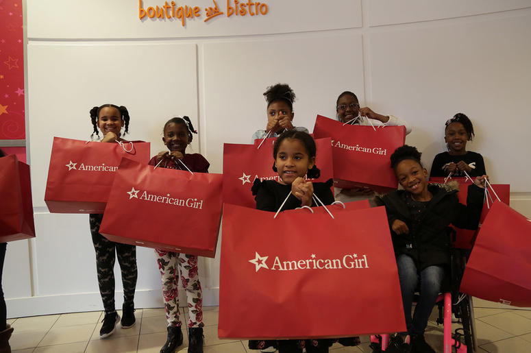 Girls receive American Girl dolls from V-103's Frank and Wanda In The Morning Girls receive American Girl dolls from V-103's Frank and Wanda In The Morning