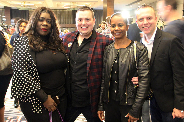 A group of smiling attendees at Stacey Abrams' election night campaign party A group of smiling attendees at Stacey Abrams' election night campaign party