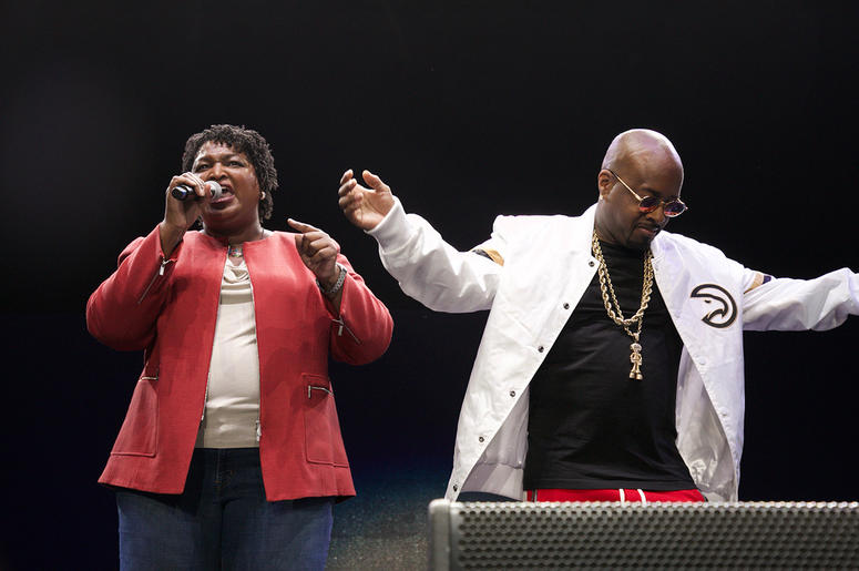 Stacey Abrams and Jermaine Dupri on stage at State Farm Arena Stacey Abrams and Jermaine Dupri on stage at State Farm Arena