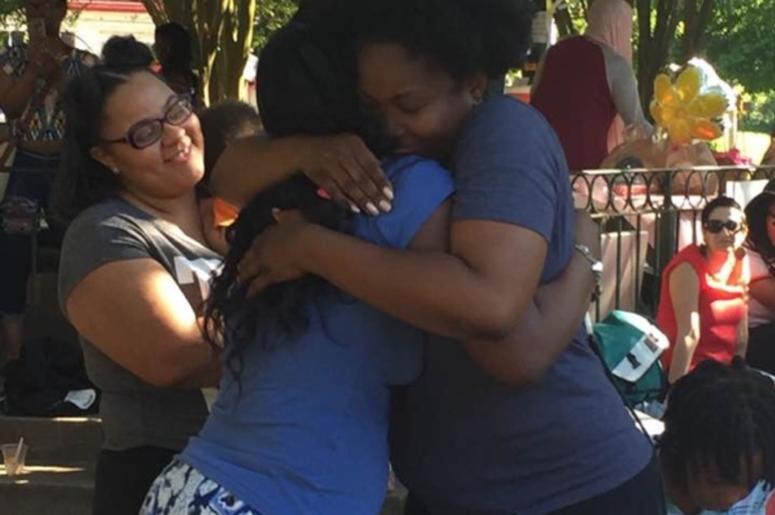 A bailed out mother is welcomed during a Black Mama's Homecoming event