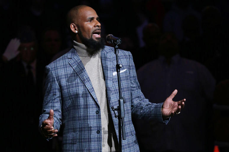 R. Kelly performs the National Anthem prior to the game between the Brooklyn Nets and the Atlanta Hawks at Barclays Center in 2015. R. Kelly performs the National Anthem prior to the game between the Brooklyn Nets and the Atlanta Hawks at Barclays Center in 2015.