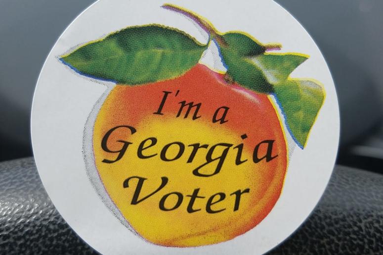 Georgia peach stickers are given to voters on election day