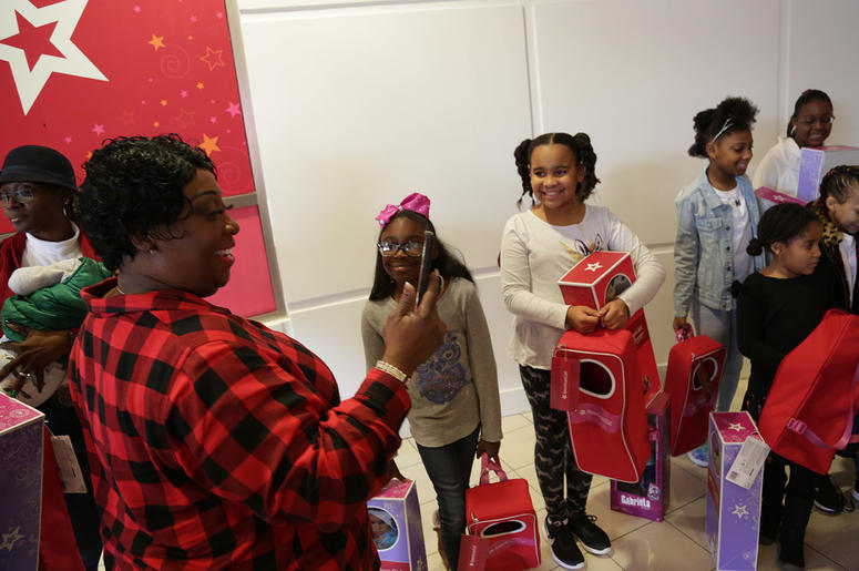 Girls receive American Girl dolls from V-103's Frank and Wanda In The Morning Girls receive American Girl dolls from V-103's Frank and Wanda In The Morning