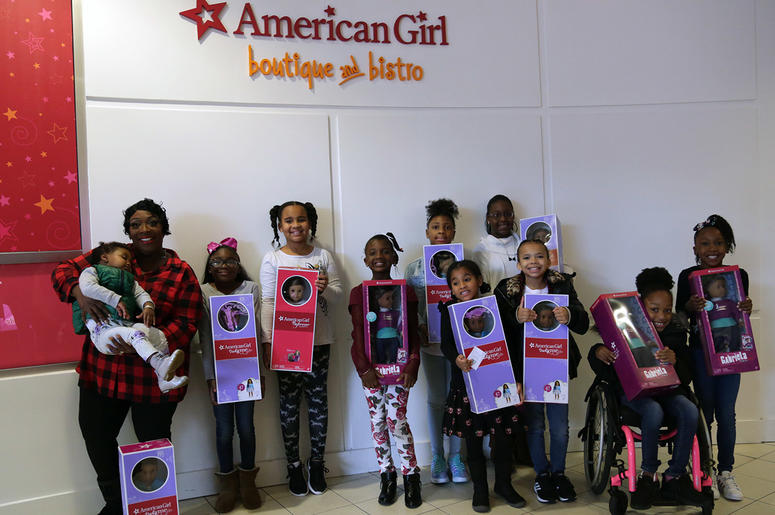 Girls receive American Girl dolls from V-103's Frank and Wanda In The Morning Girls receive American Girl dolls from V-103's Frank and Wanda In The Morning