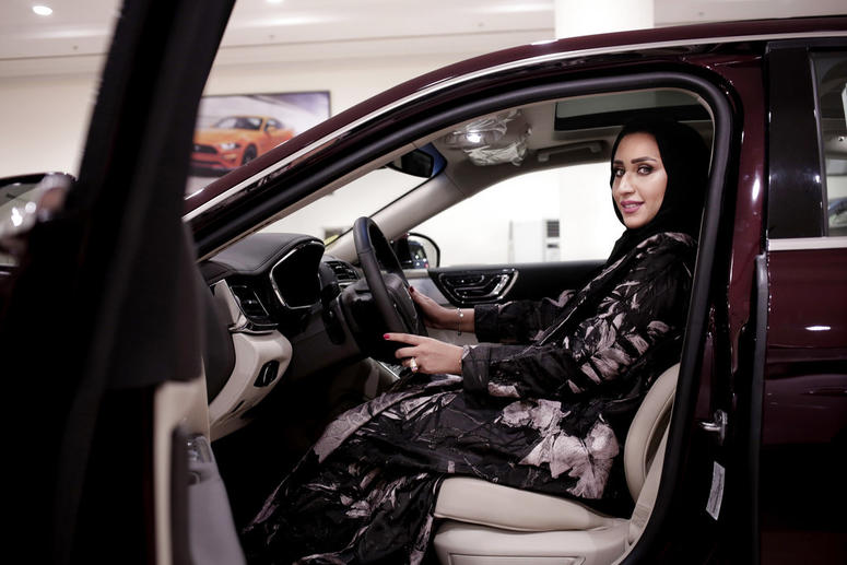 Maram Al-Hazer poses for a photograph inside a Lincoln Continental at Al-Jazirah Ford Maram Al-Hazer poses for a photograph inside a Lincoln Continental at Al-Jazirah Ford