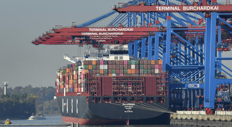 container ship is loaded at the harbor in Hamburg, Germany container ship is loaded at the harbor in Hamburg, Germany
