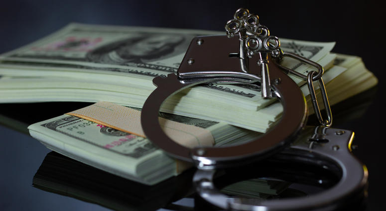 handcuffs and money handcuffs and money