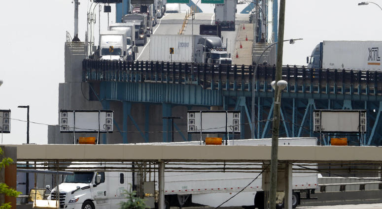 Trucks cross the Ambassador Bridge Trucks cross the Ambassador Bridge