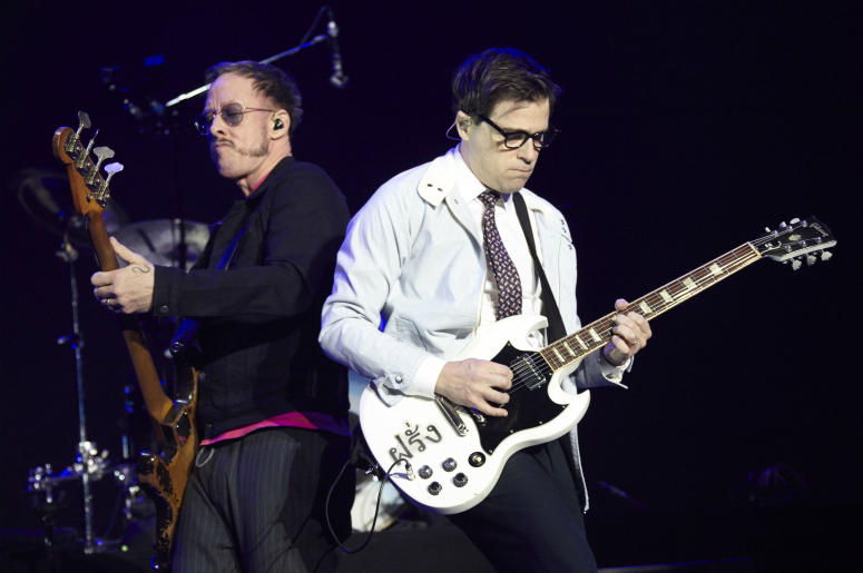 Scott Shriner and Rivers Cuomo of Weezer perform onstage during KROQ Almost Acoustic Christmas 2017 Scott Shriner and Rivers Cuomo of Weezer perform onstage during KROQ Almost Acoustic Christmas 2017