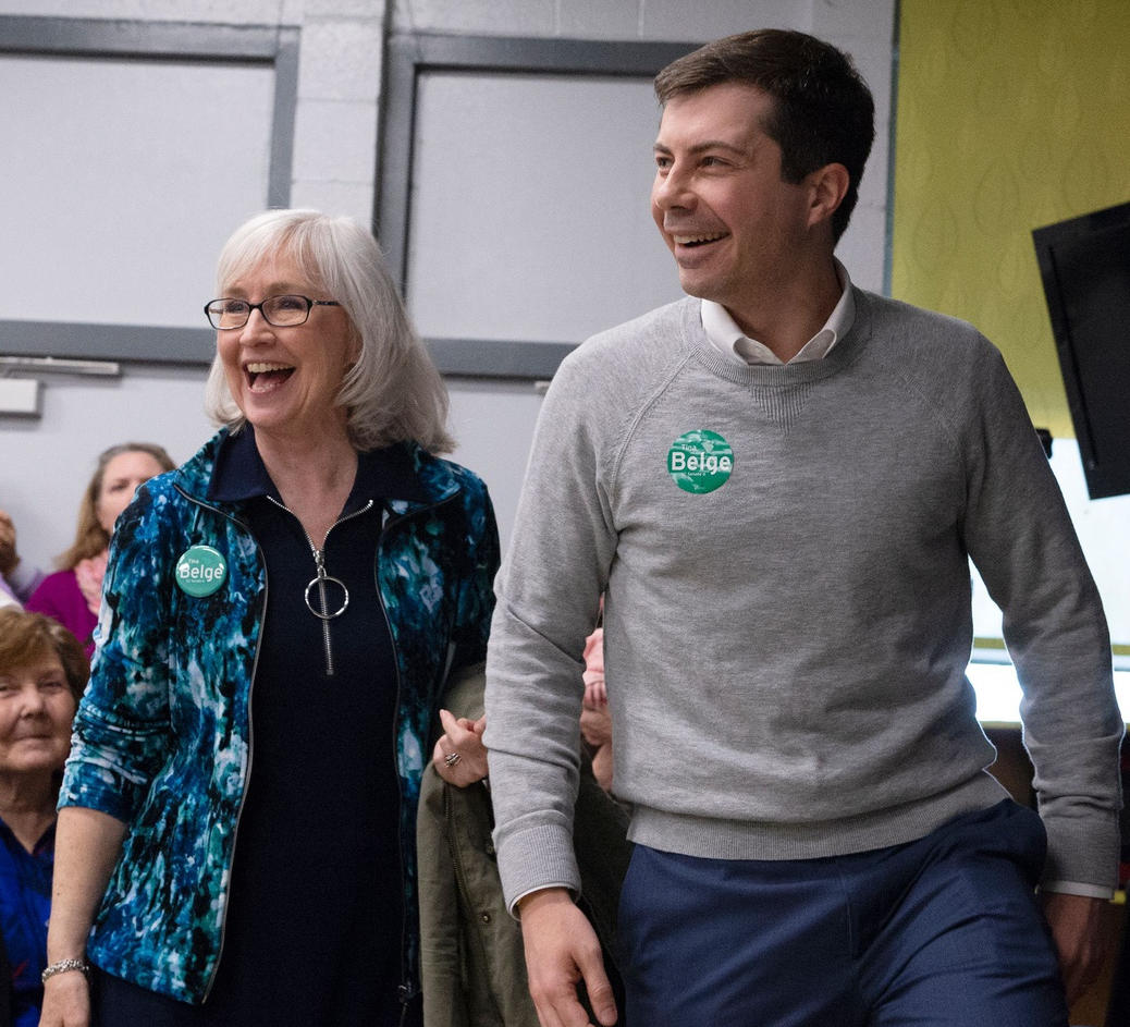 Pete Buttigieg walks with Kate Franch, chair of the Greenville County Democratic Party, Democratic Presidential candidate Pete Buttigieg