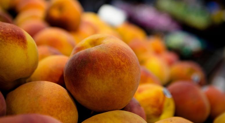 Peaches on display at a grocery store Peaches on display at a grocery store