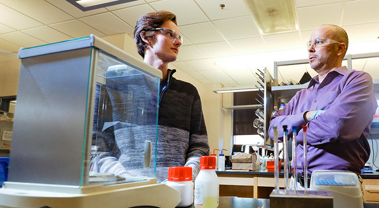 Chemistry professor Greg Springsteen talks in his lab with student Chandler Joel Rhea in a January 2018 photo.