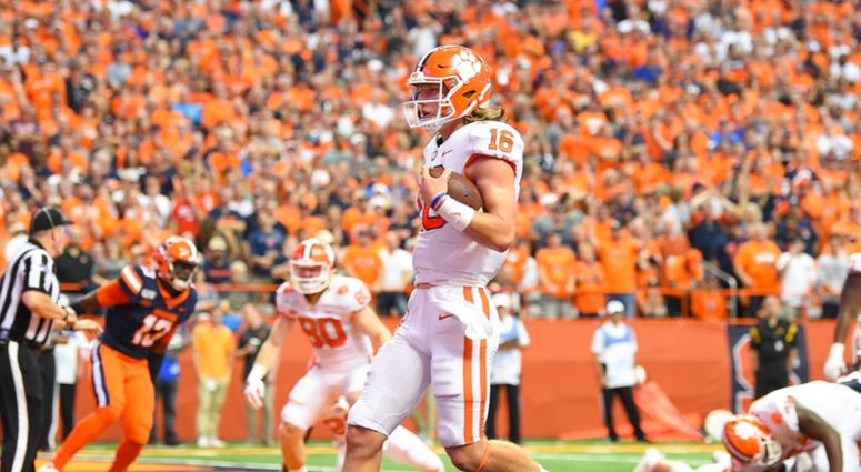 Clemson Tigers quarterback Trevor Lawrence (16) runs into the end zone for a touchdown against the Syracuse Orange during the first quarter at the Carrier Dome.