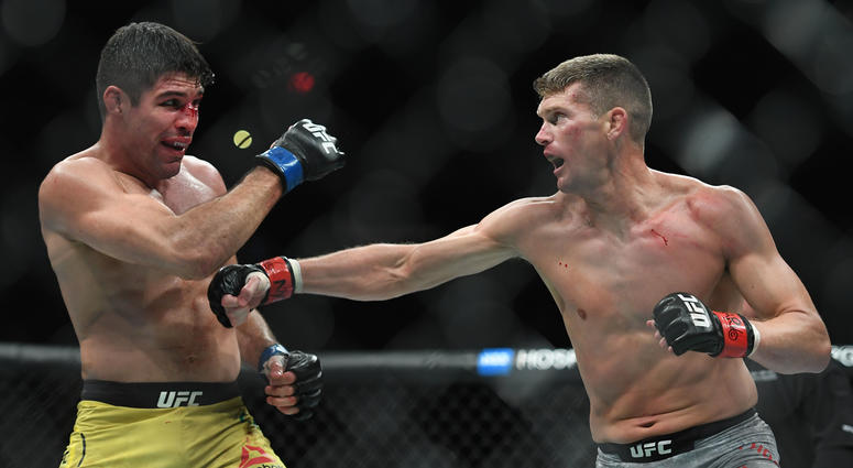 Nov 2, 2019; New York, NY, USA; Stephen Thompson (red gloves) fights Vicente Luque (blue gloves) during UFC 244 at Madison Square Garden. Mandatory Credit: Sarah Stier-USA TODAY Sports