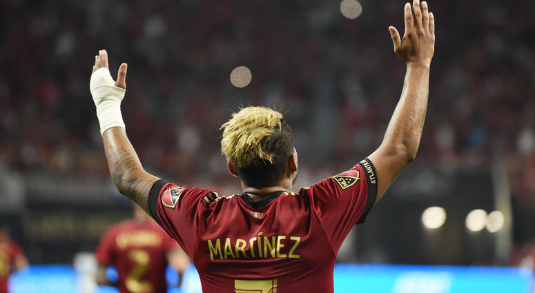 Atlanta United forward Josef Martinez (7) celebrates after scoring a hat trick on a penalty kick against the Philadelphia Union during the second half at Mercedes-Benz Stadium.