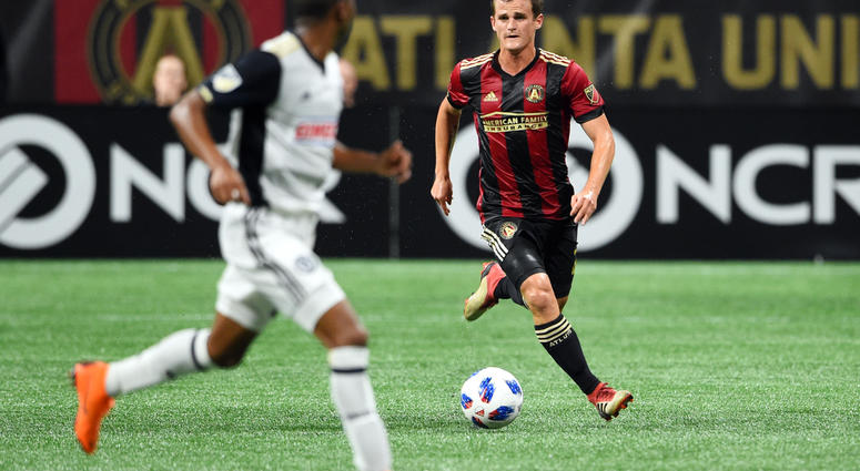 Atlanta United defender Mikey Ambrose (22) handles the ball against Philadelphia Union defender Ray Gaddis (28) during the second half at Mercedes-Benz Stadium