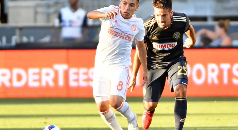 Atlanta United midfielder Ezequiel Barco (8) pushes past Philadelphia Union midfielder Ilsinho (25) during the first half at Talen Energy Stadium.