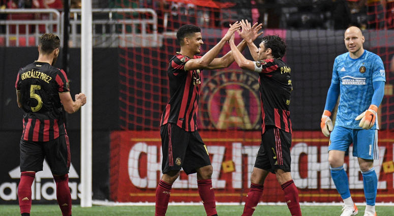 Atlanta United Defenders Leando Gonzalez Pirez, Miles Robinson, and Michael Parkhurst, and Goalie Brad Guzan